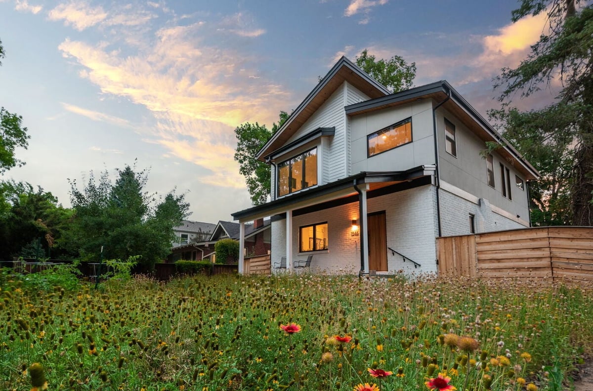 Denver pop top renovation exterior at sunset with modern design, native landscaping, and wood accents by Cillessen Construction