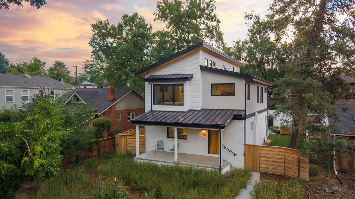 Denver pop top renovation exterior with covered porch, landscaped yard, and modern design in Denver by Cillessen Construction