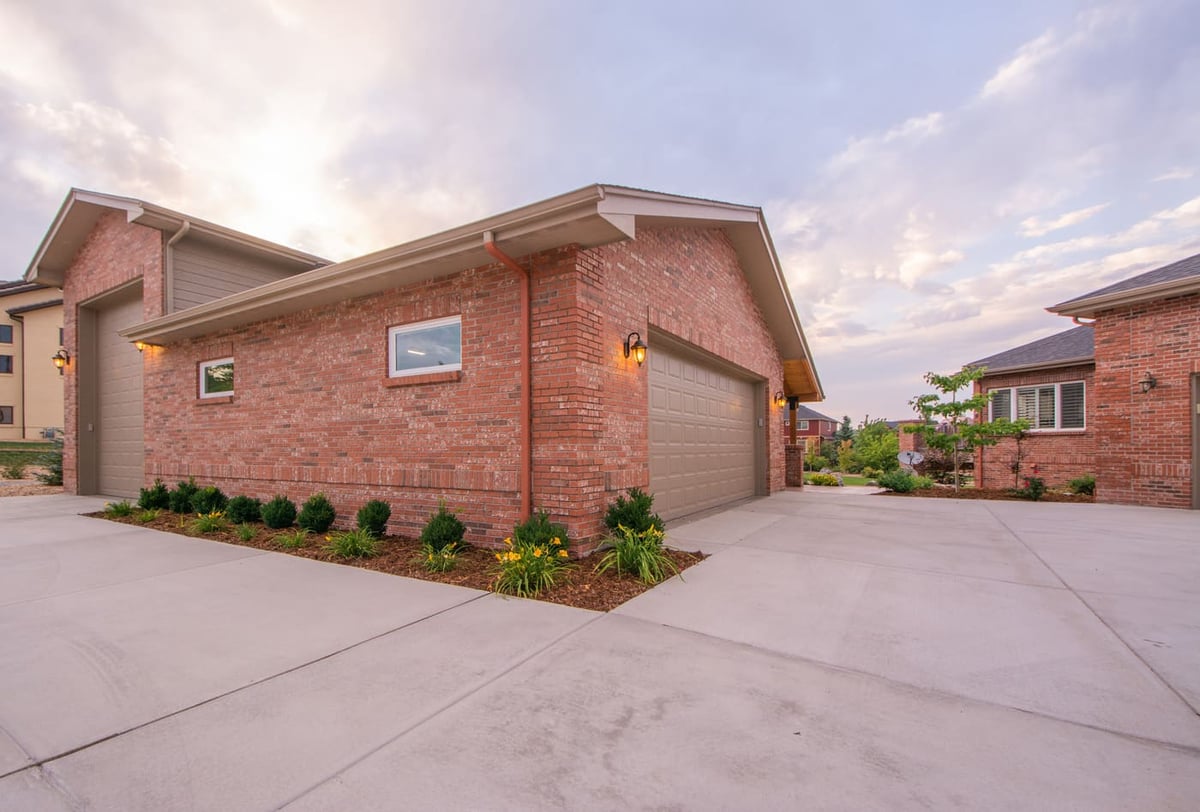 Brick garage exterior with driveway  in Arvada, CO by Cillessen Construction