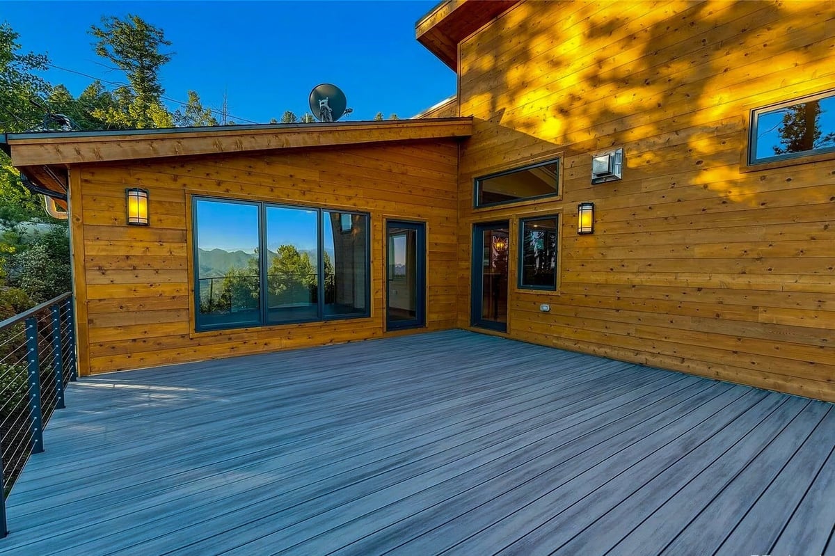 denver-colorado-aerial-view-of-mountain-home-by-cillessen-construction-company-surrounded-by-dense-forest-landscape