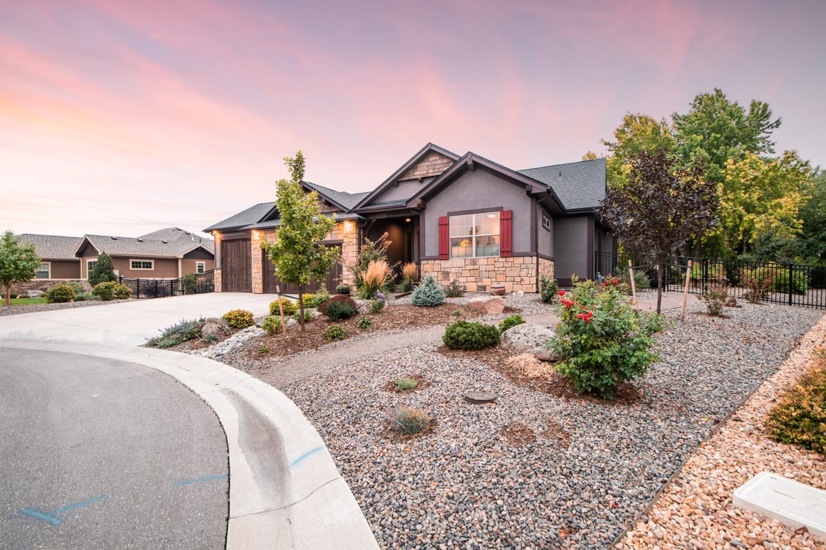 angled view of home exterior with garden beds and driveway in denver colorado exterior renovation