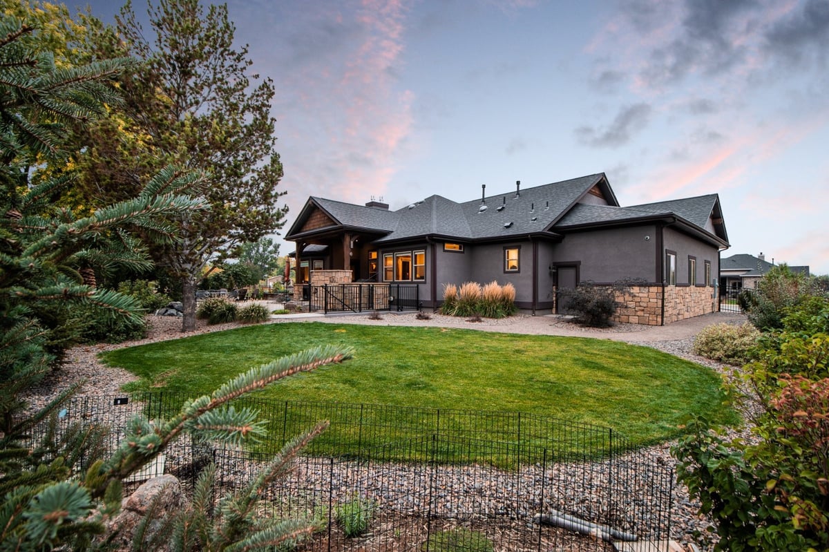 covered backyard patio with seating and outdoor living design in denver colorado exterior renovation