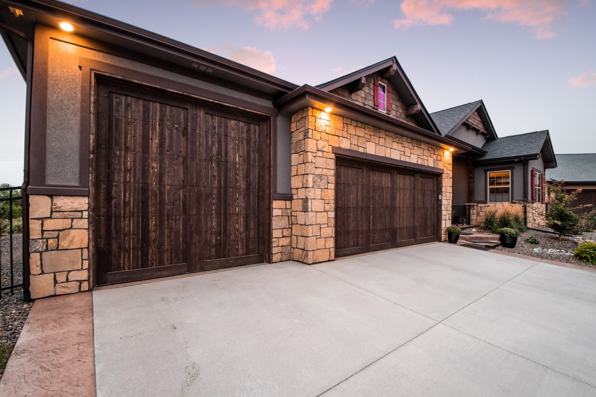 garage exterior with stone detail and concrete driveway in denver colorado exterior renovation