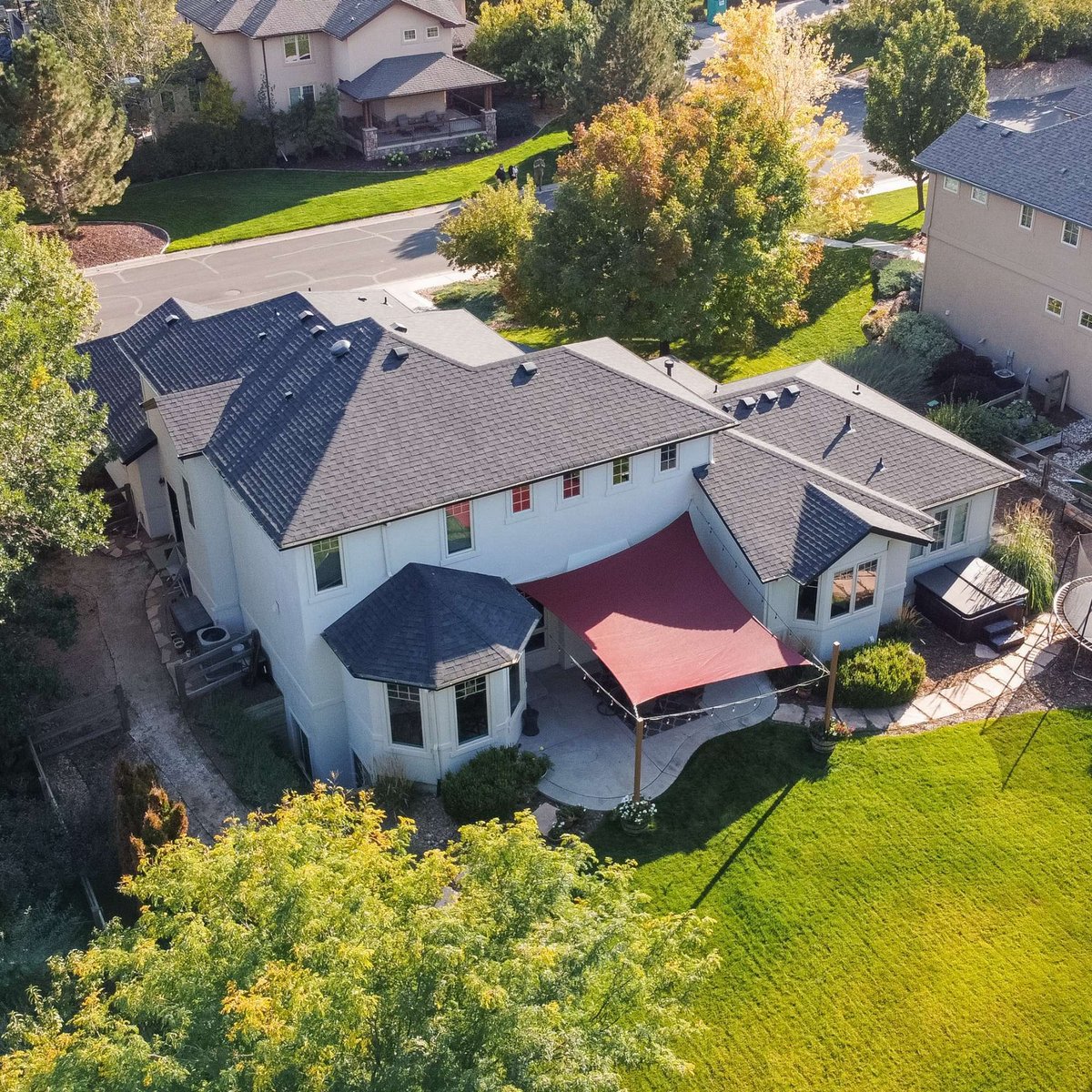 drone view of backyard and roof exterior restoration project in denver colorado with curved walkway and landscaped garden