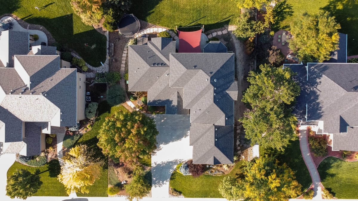 top down aerial view of home with exterior restoration roofing in denver colorado showing full roof layout and surrounding homes