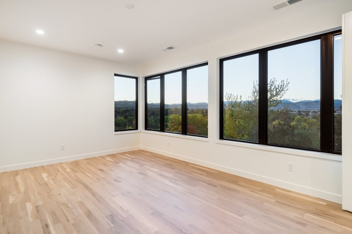 bright bedroom with panoramic windows in applewood village pop top renovation