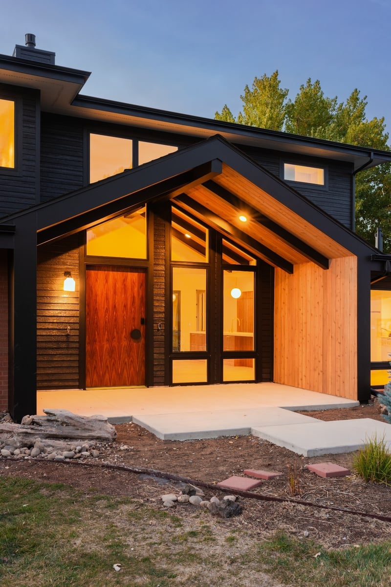 contemporary home exterior at dusk in applewood village pop top renovation