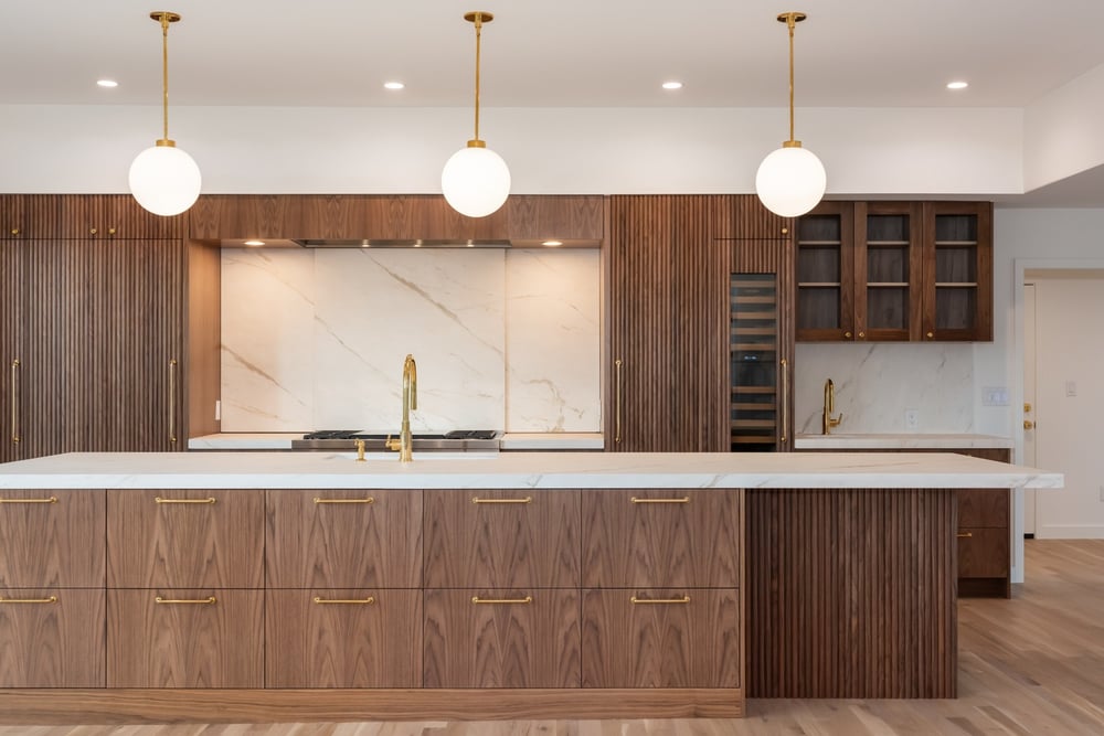 modern kitchen island and range wall in applewood village pop top renovation