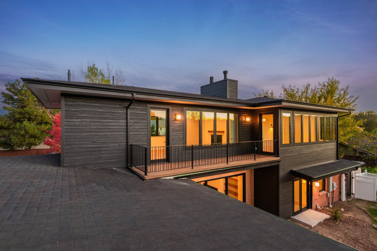 modern rear exterior with elevated deck in applewood village pop top renovation