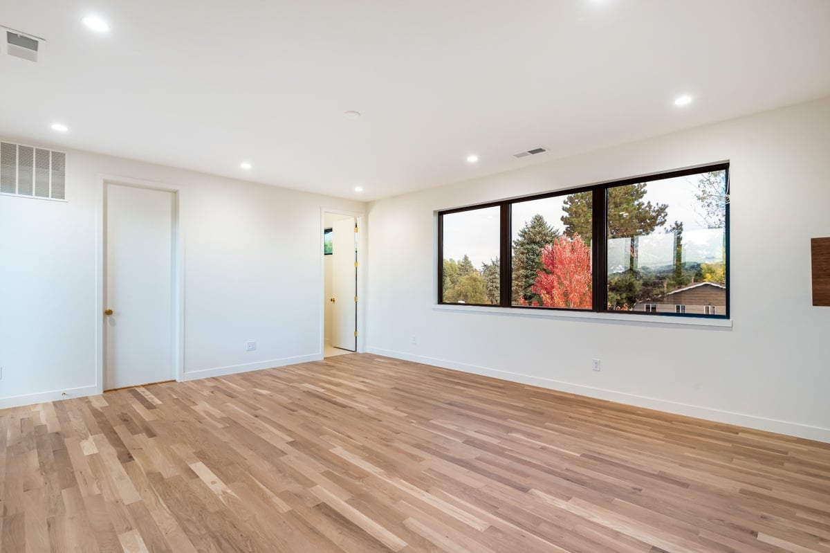 spacious bedroom with mountain views in applewood village pop top renovation