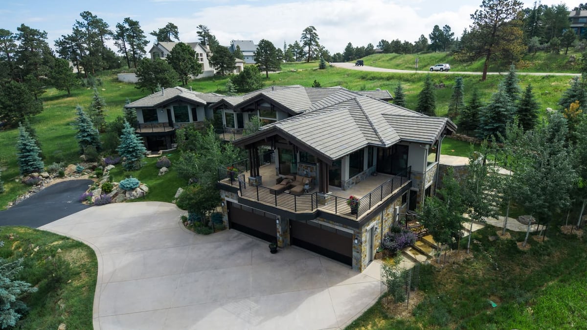 Genesee, CO renovation aerial showing home, driveway, and landscaped yard by Cillessen Construction