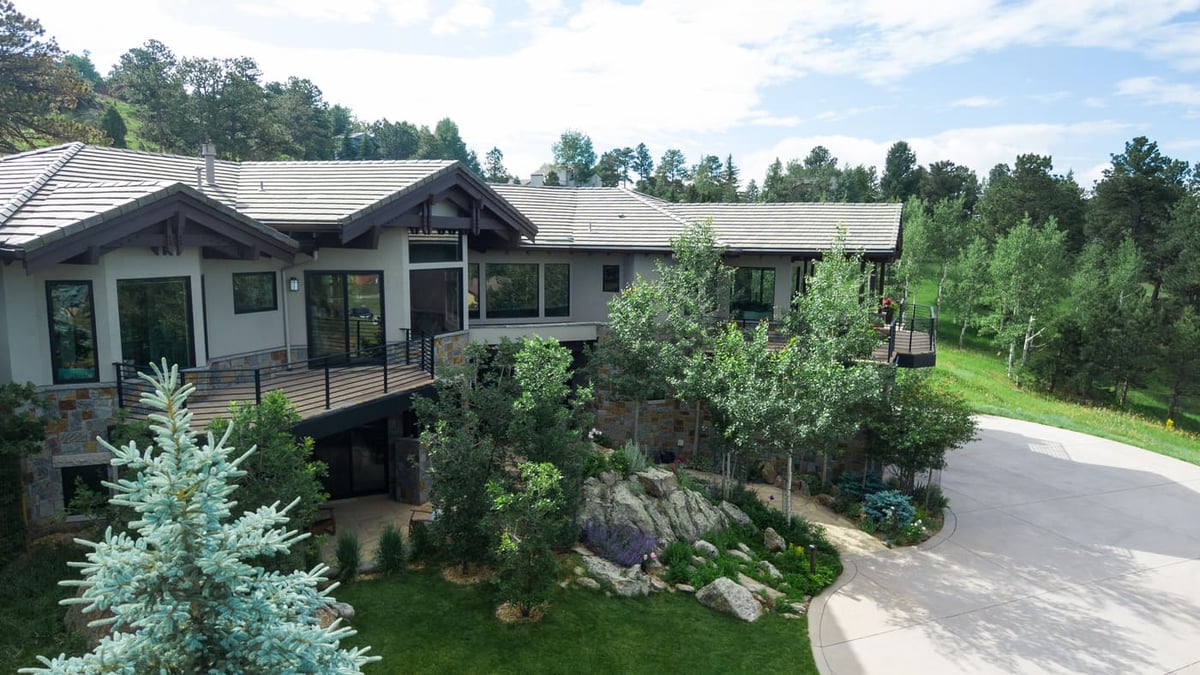 Genesee, CO renovation angled view of home, deck, and landscaped yard by Cillessen Construction
