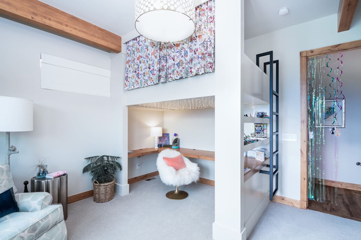 Genesee, CO renovation kids loft with built-in desk and playful decor by Cillessen Construction
