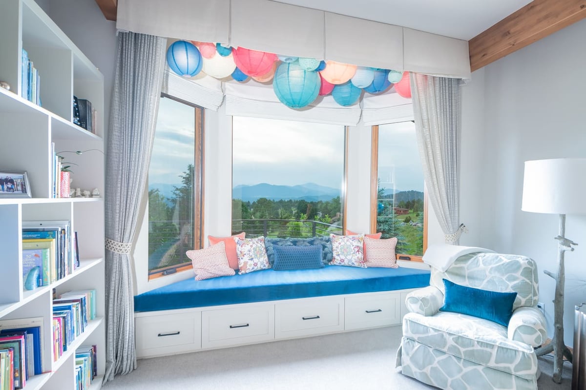 Genesee, CO renovation reading nook with window bench and mountain views by Cillessen Construction