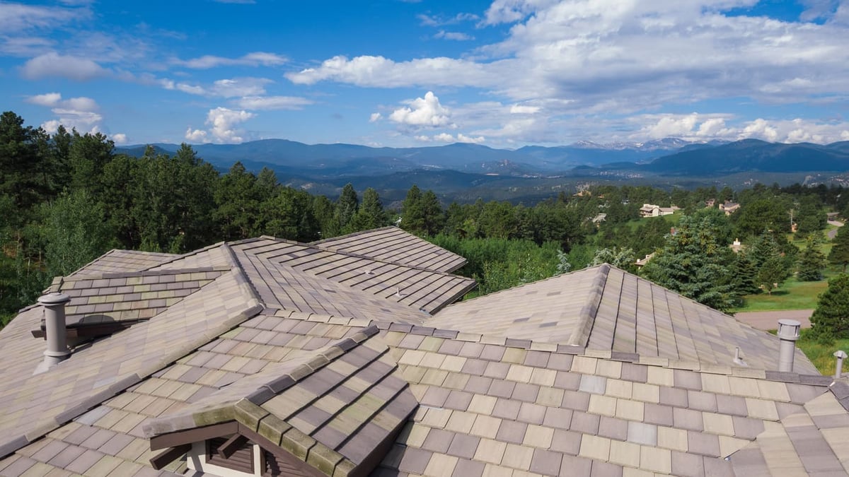 Genesee, CO renovation roof view with mountain backdrop and surrounding forest by Cillessen Construction