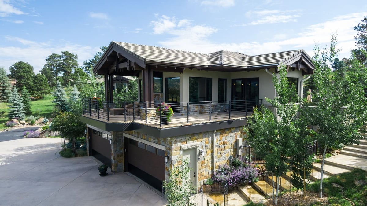 Genesee, CO renovation with elevated deck, stone garage, and landscaping by Cillessen Construction