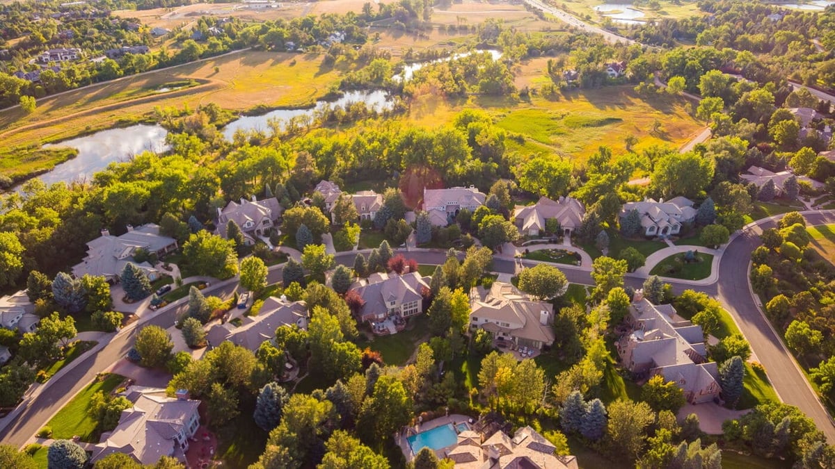 Aerial view of Greenwood Village, CO neighborhood with ponds and tree-lined streets, renovation by Cillessen Construction
