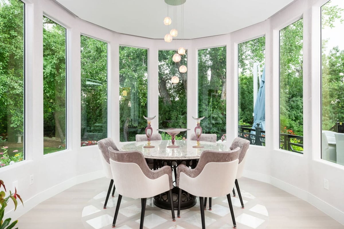 Greenwood Village, CO breakfast nook with garden views and modern seating by Cillessen Construction renovation