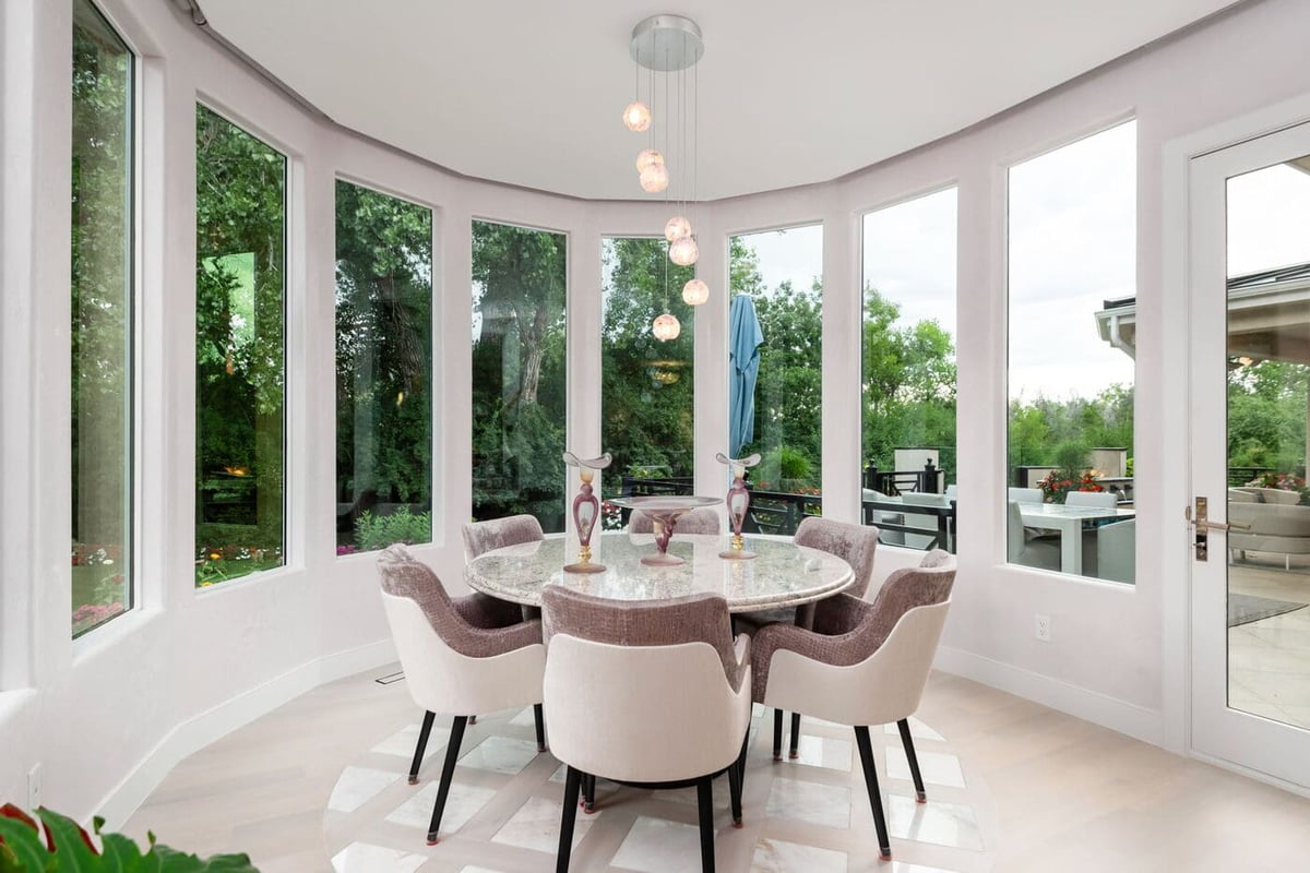 Greenwood Village, CO breakfast nook with round table and panoramic windows by Cillessen Construction renovation