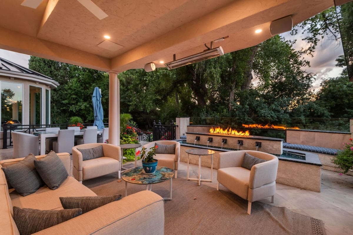 Greenwood Village, CO covered patio seating with fire feature and heaters, renovation by Cillessen Construction