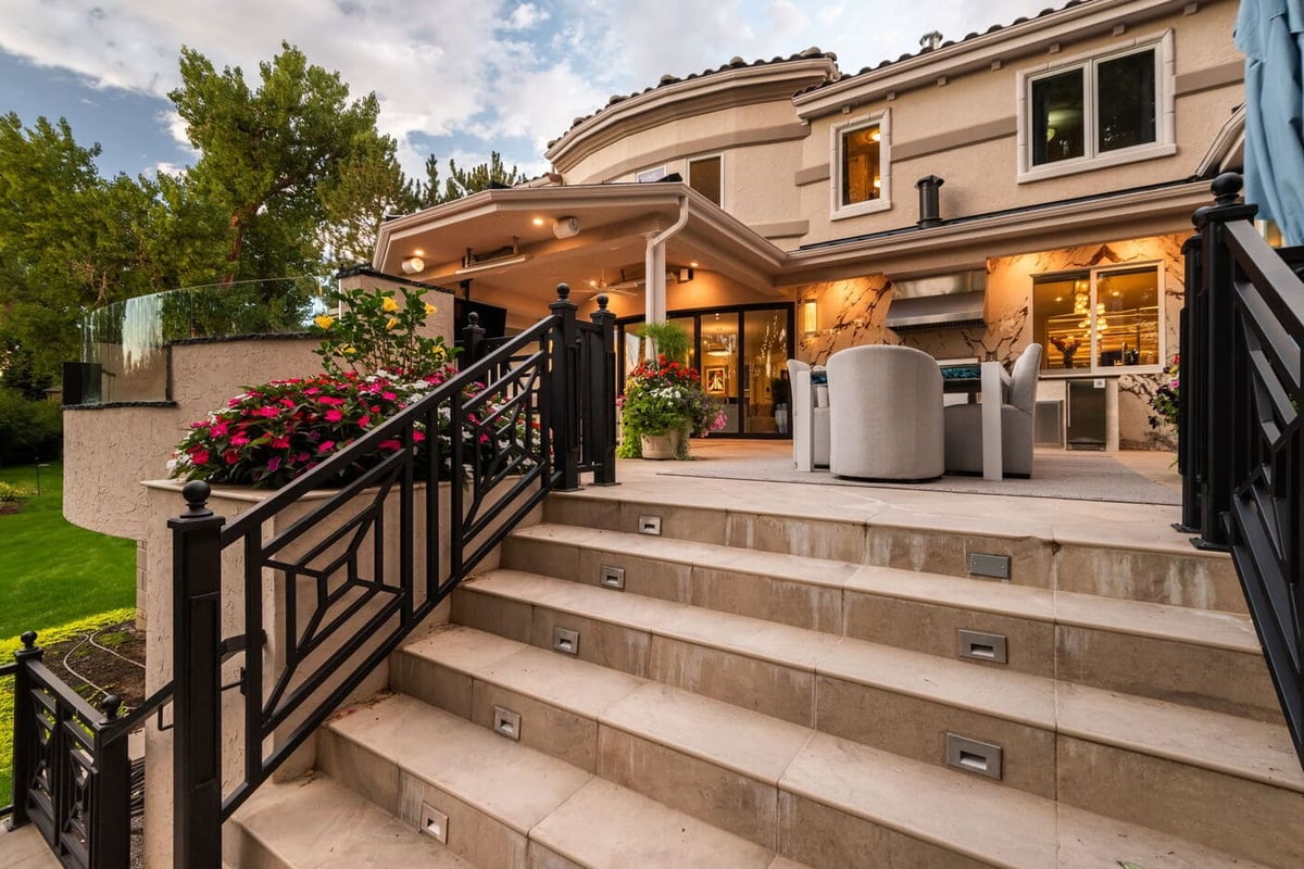 Greenwood Village, CO exterior patio with stairs, seating, and covered outdoor area, by Cillessen Construction