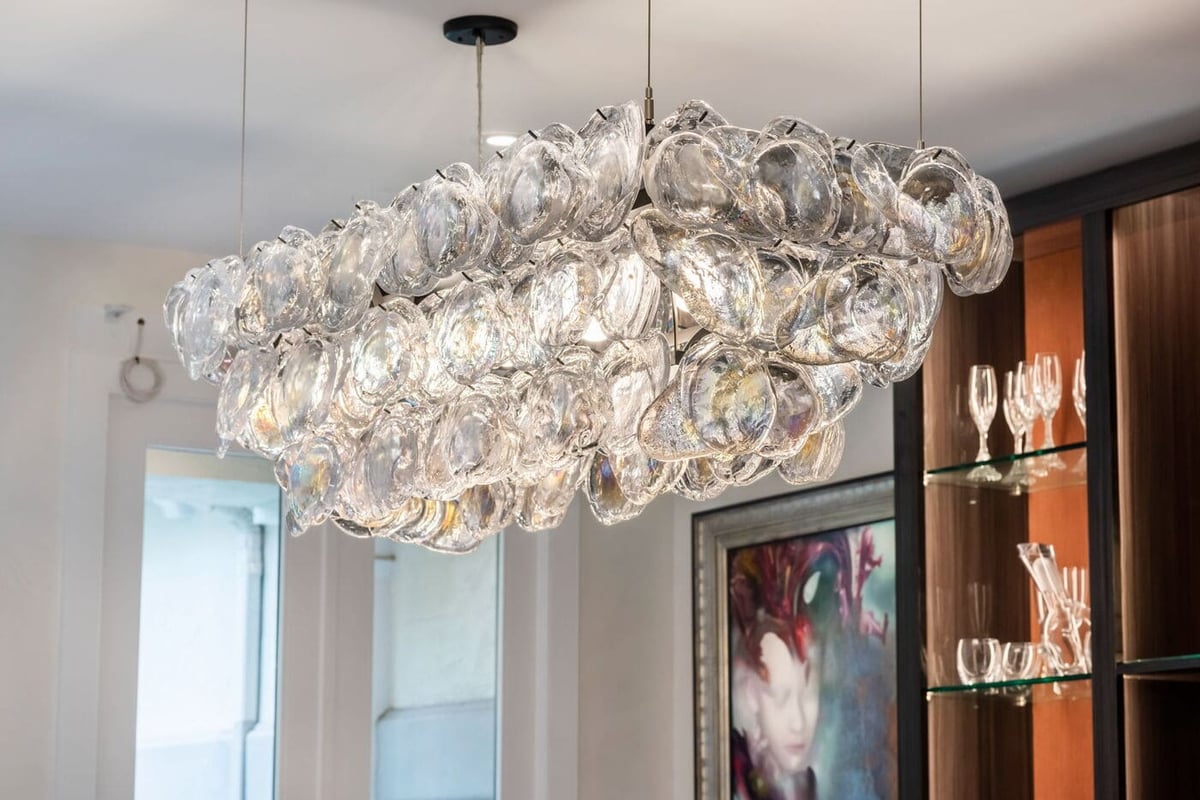 Greenwood Village, CO glass chandelier detail over dining area by Cillessen Construction renovation