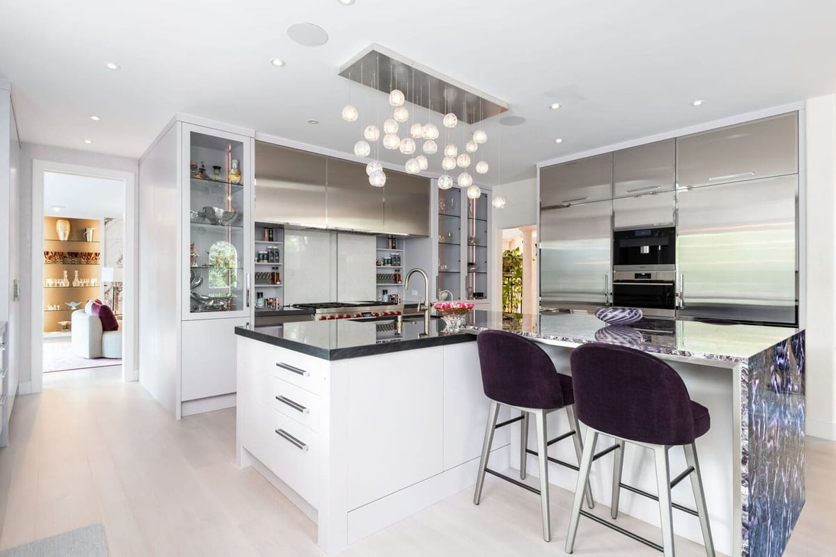 Greenwood Village, CO kitchen renovation with large island, bar seating, and sleek cabinetry by Cillessen Construction