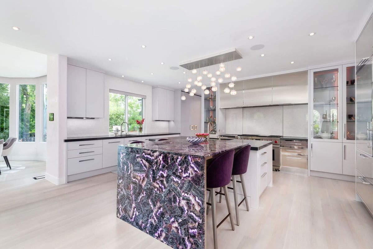 Greenwood Village, CO kitchen renovation with waterfall island, bar seating, and modern finishes by Cillessen Construction