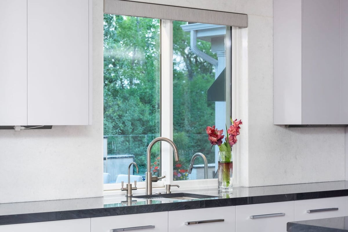 Greenwood Village, CO kitchen sink with window view and sleek fixtures by Cillessen Construction renovation