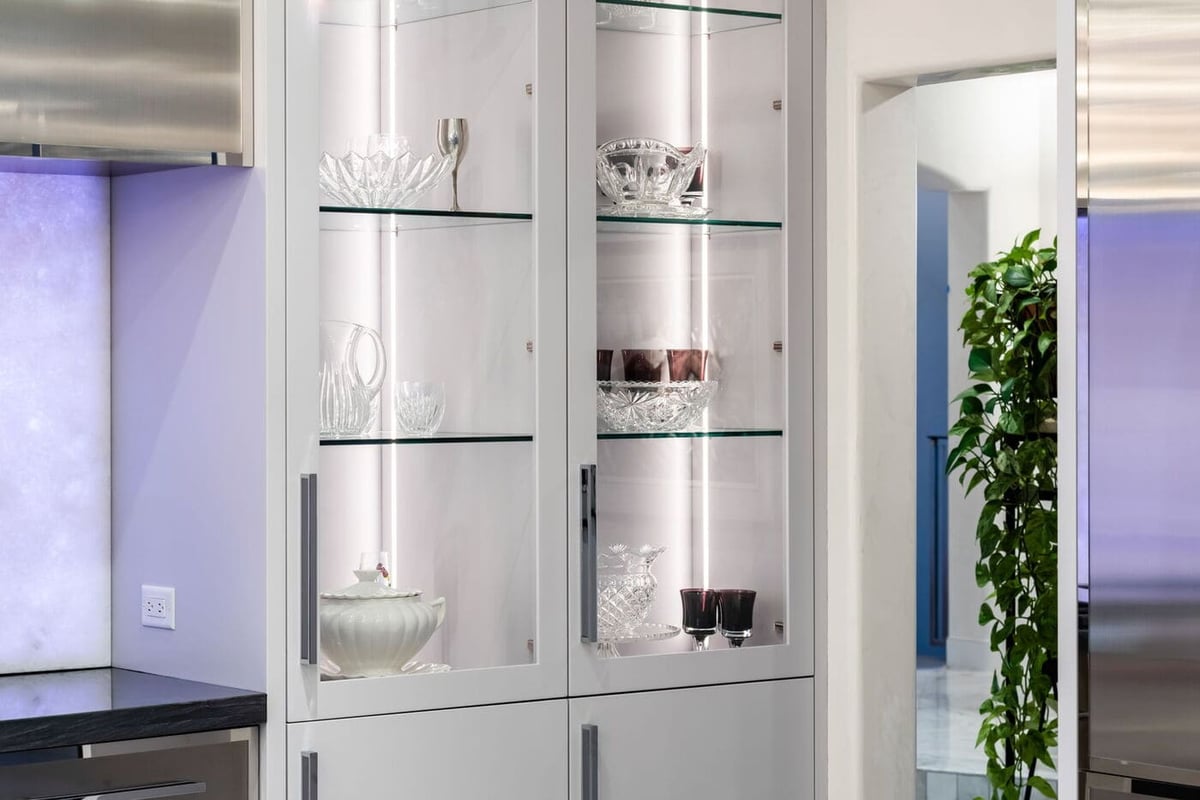 Greenwood Village, CO kitchen with glass display cabinets and accent lighting by Cillessen Construction renovation