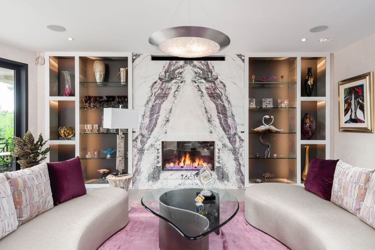 Greenwood Village, CO living room with marble fireplace and built-ins by Cillessen Construction renovation