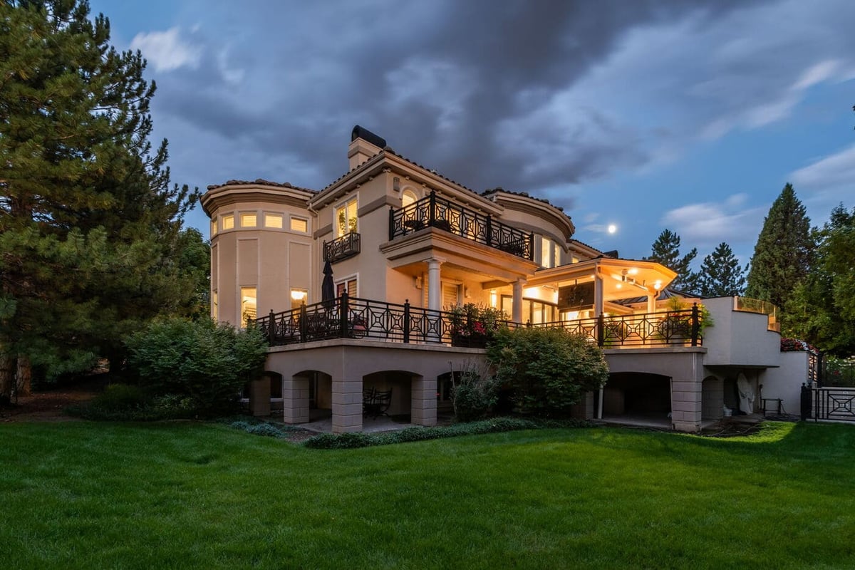 Greenwood Village, CO luxury home exterior at dusk with patio lighting, renovated by Cillessen Construction