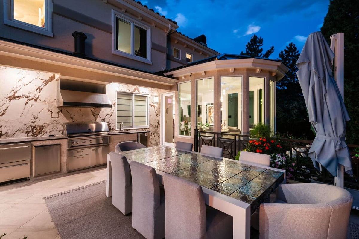 Greenwood Village, CO outdoor dining and kitchen with marble backsplash, renovation by Cillessen Construction
