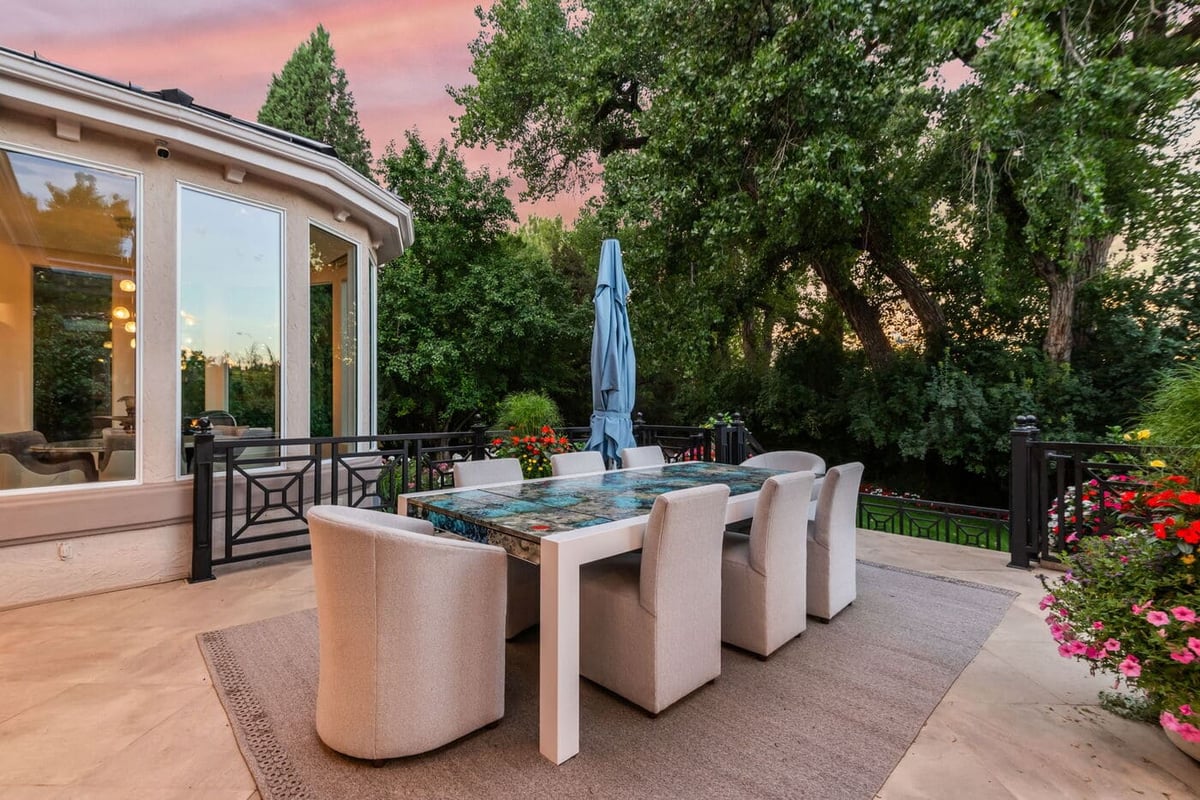 Greenwood Village, CO outdoor dining area with modern table and garden views, by Cillessen Construction