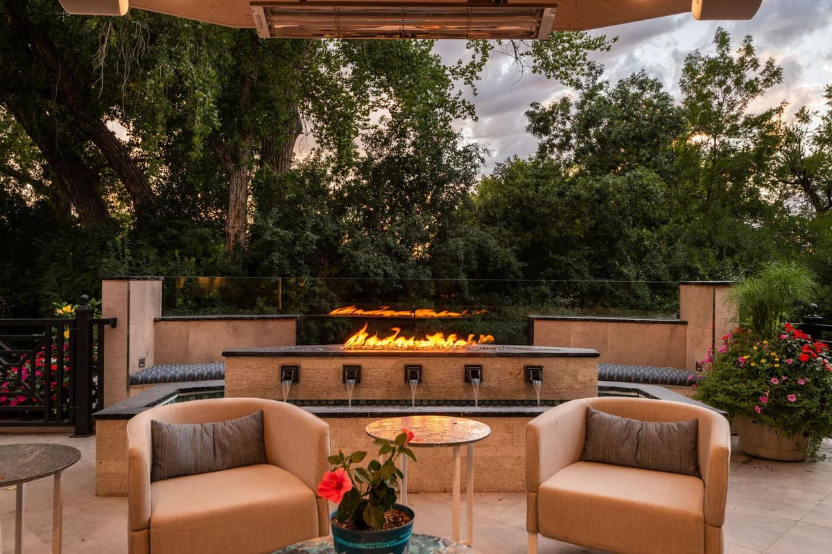 Greenwood Village, CO outdoor lounge with fire and water feature and seating, by Cillessen Construction