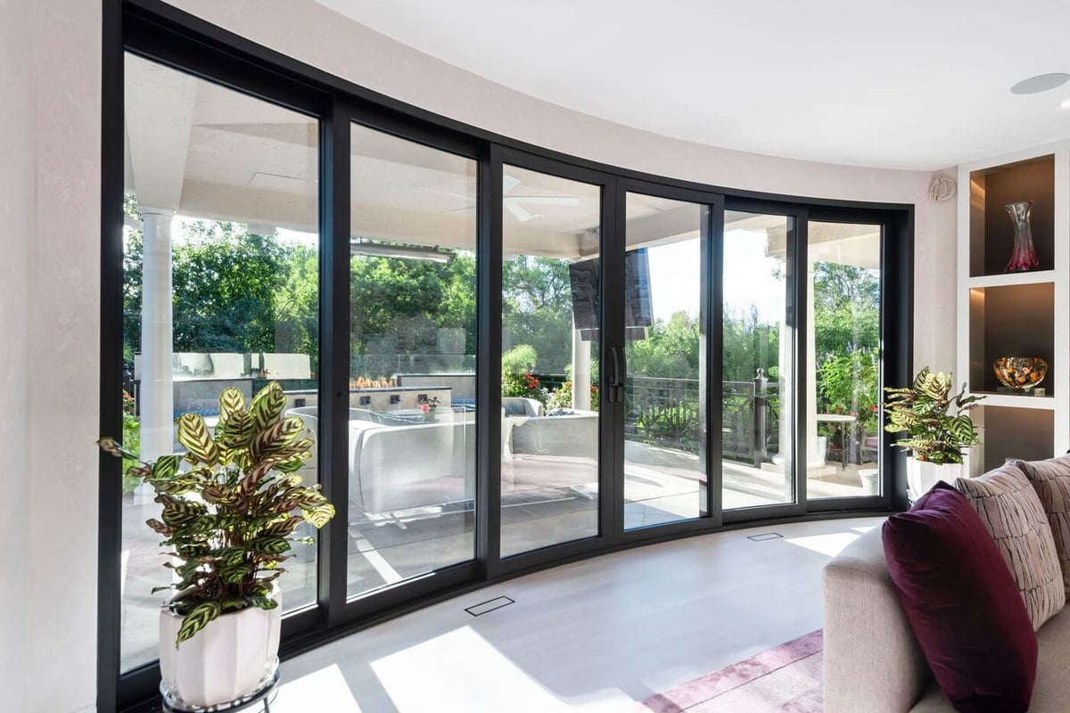 Greenwood Village, CO sliding glass doors and patio view from living room, renovation by Cillessen Construction