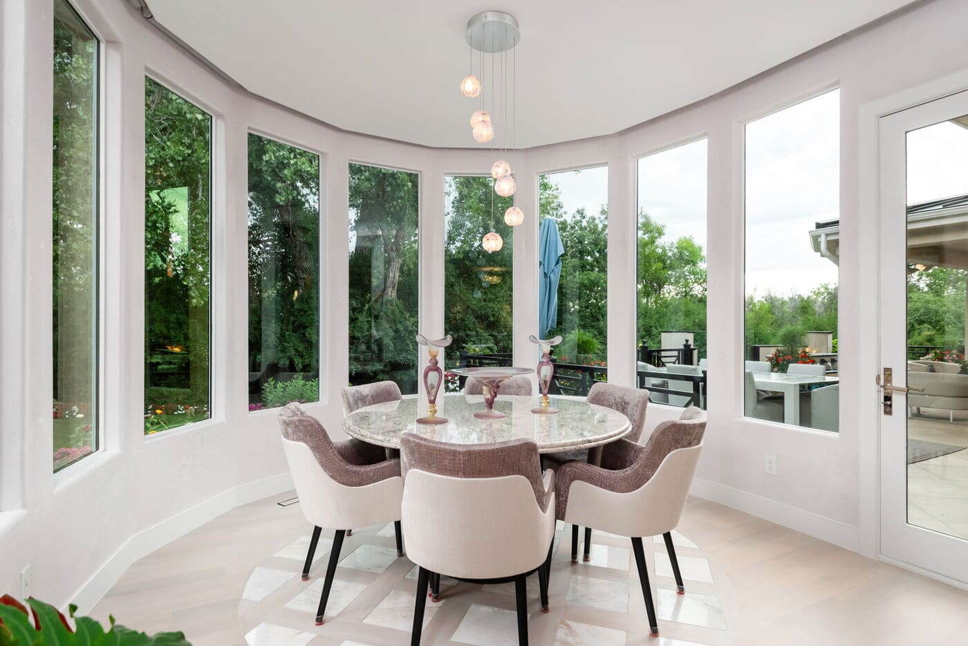 Greenwood Village, CO breakfast nook with round table and panoramic windows by Cillessen Construction renovation