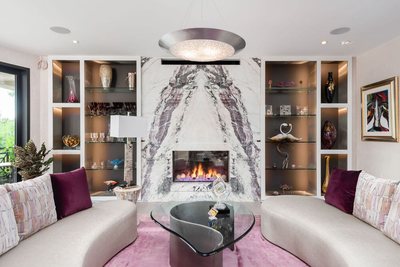 Greenwood Village, CO living room with marble fireplace and built-ins by Cillessen Construction renovation
