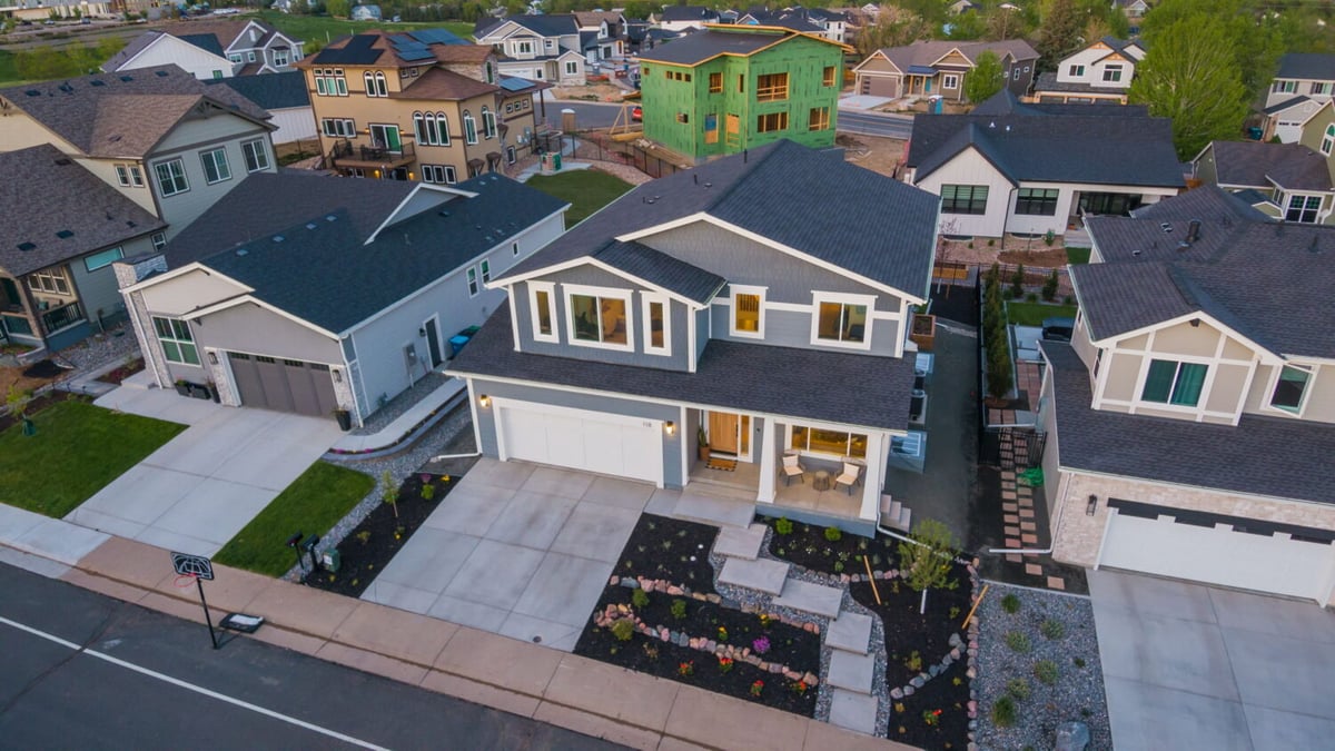 Front exterior with driveway and landscaping of custom home in Louisville, CO by Cillessen Construction
