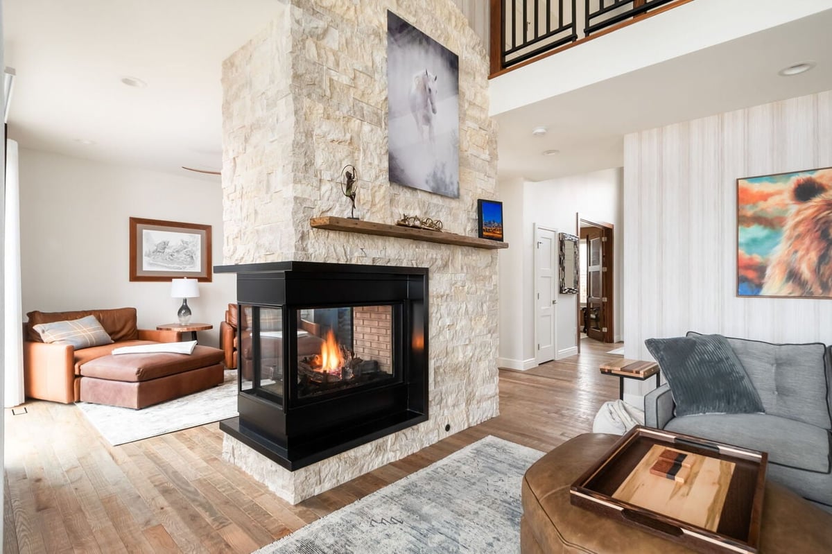 Littleton, CO whole home renovation featuring stone fireplace, open layout, and modern finishes by Cillessen Construction