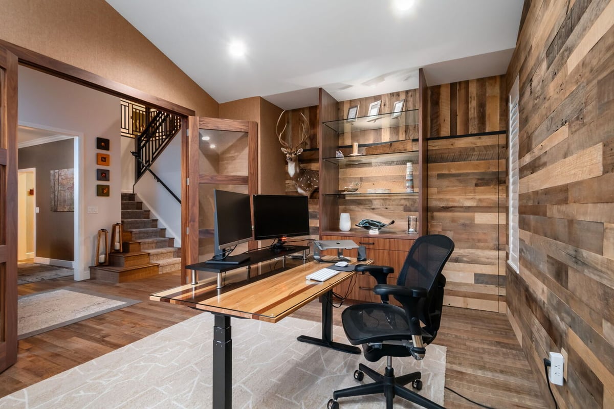 Littleton, CO whole home renovation home office with wood accent walls, built-ins, and dual monitors by Cillessen Construction
