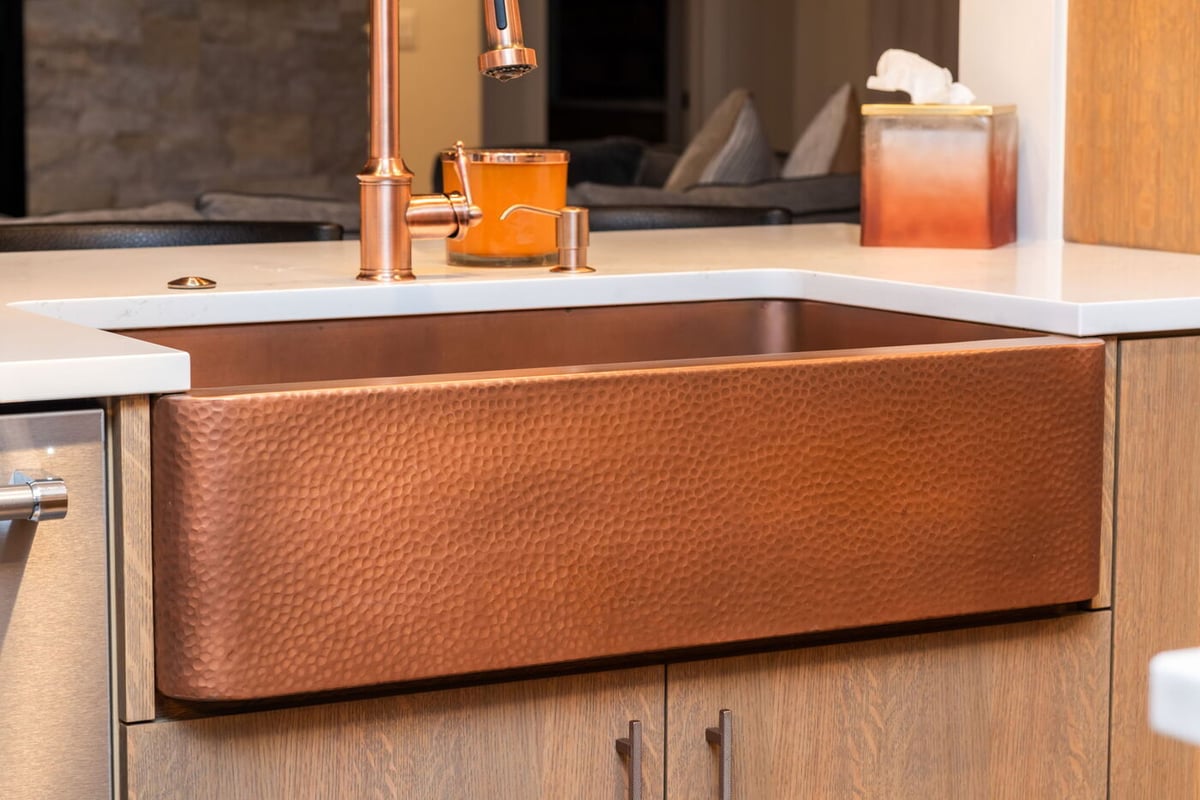 Littleton, CO whole home renovation kitchen detail of hammered copper sink and faucet by Cillessen Construction