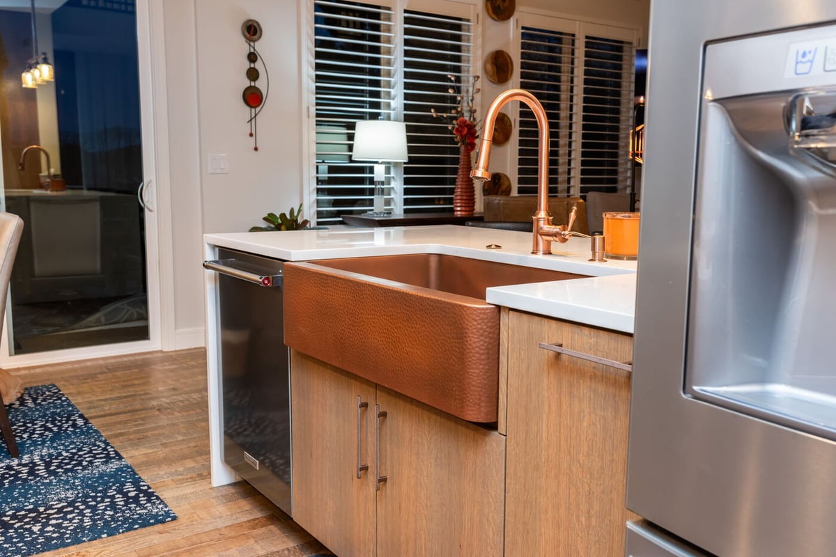 Littleton, CO whole home renovation kitchen with copper farmhouse sink and modern fixtures by Cillessen Construction