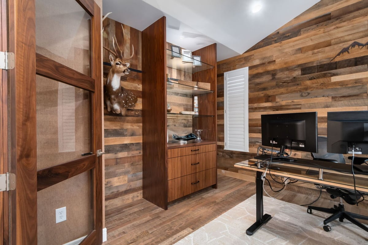 Littleton, CO whole home renovation office with wood walls, built-in shelving, and workspace by Cillessen Construction