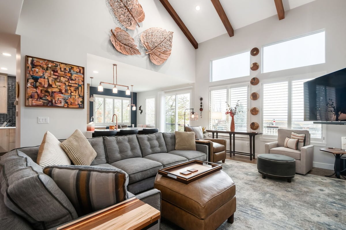 Littleton, CO whole home renovation open living space with large windows, wood beams, and updated kitchen by Cillessen Construction