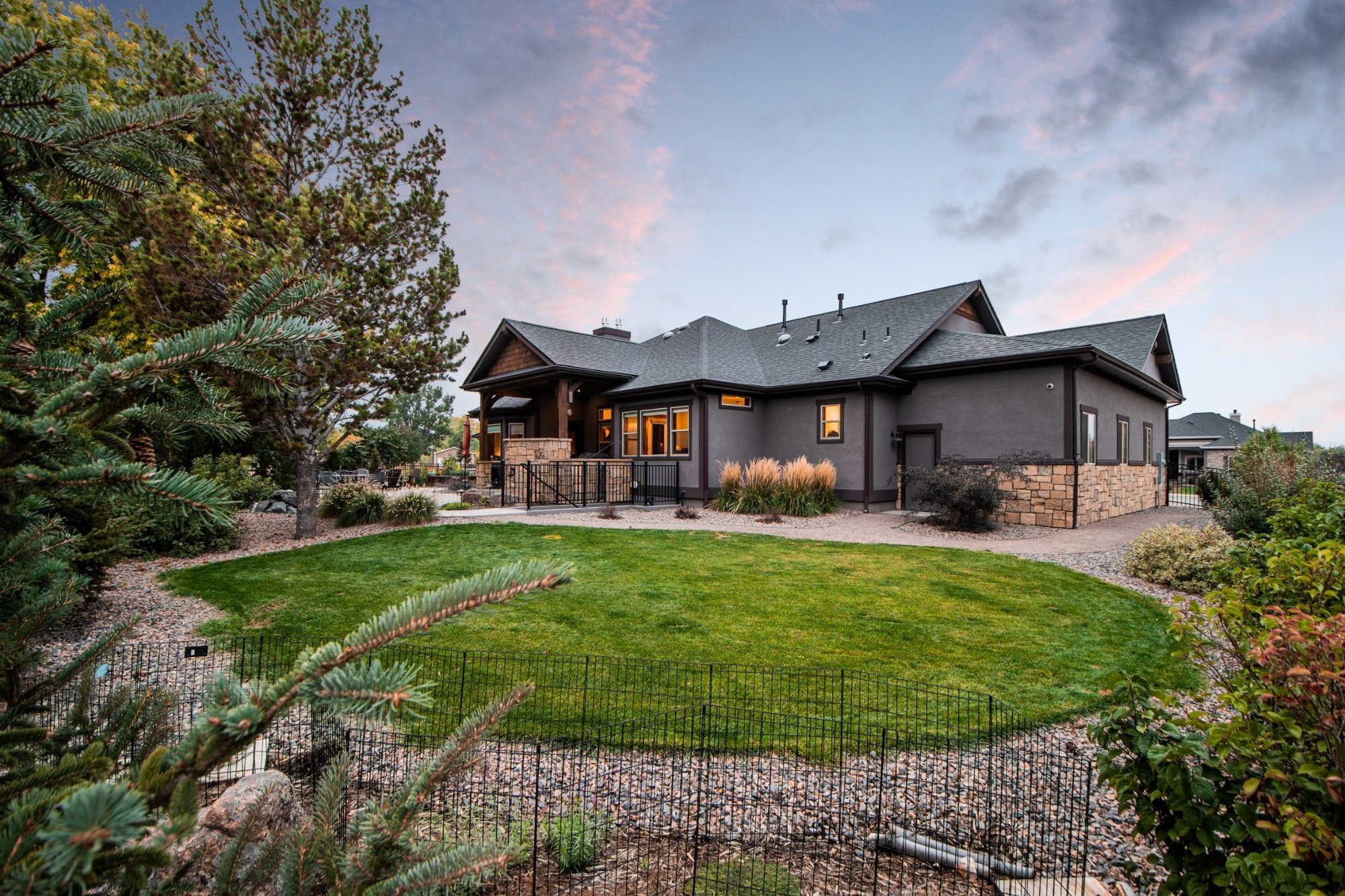 covered backyard patio with seating and outdoor living design in denver colorado exterior renovation