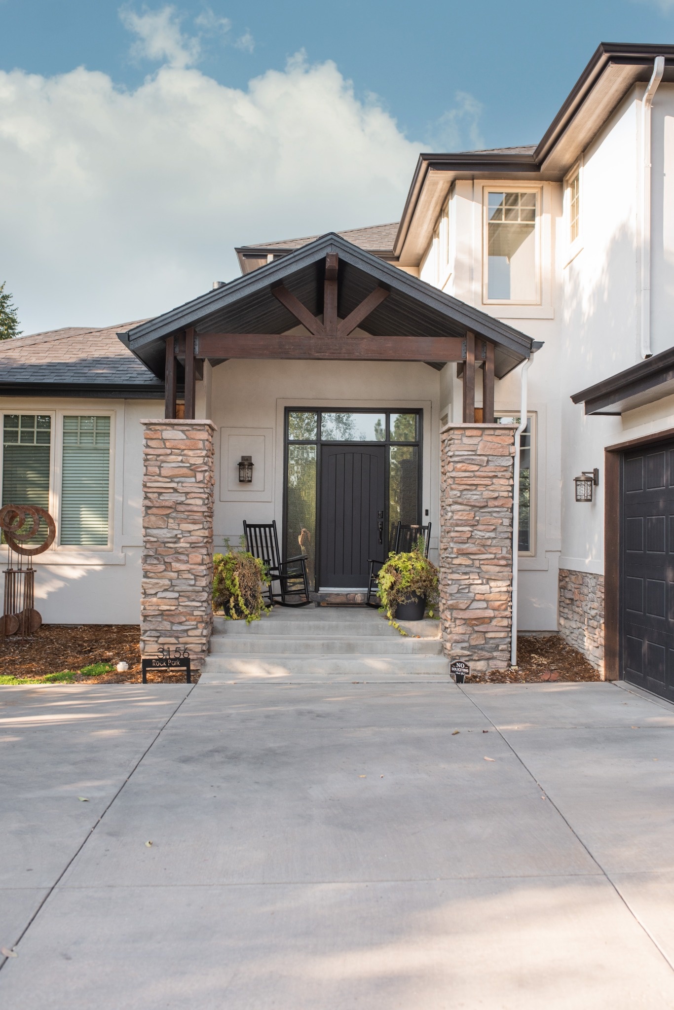 side exterior of home with exterior restoration roofing in denver colorado and landscaped garden bed