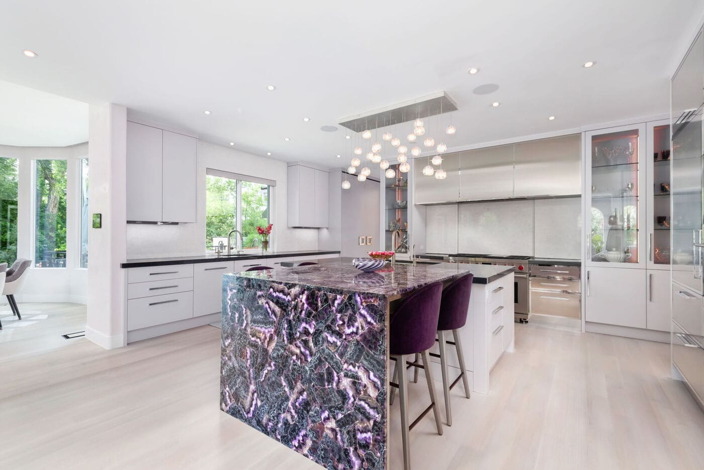 Greenwood Village, CO kitchen renovation with waterfall island, bar seating, and modern finishes by Cillessen Construction