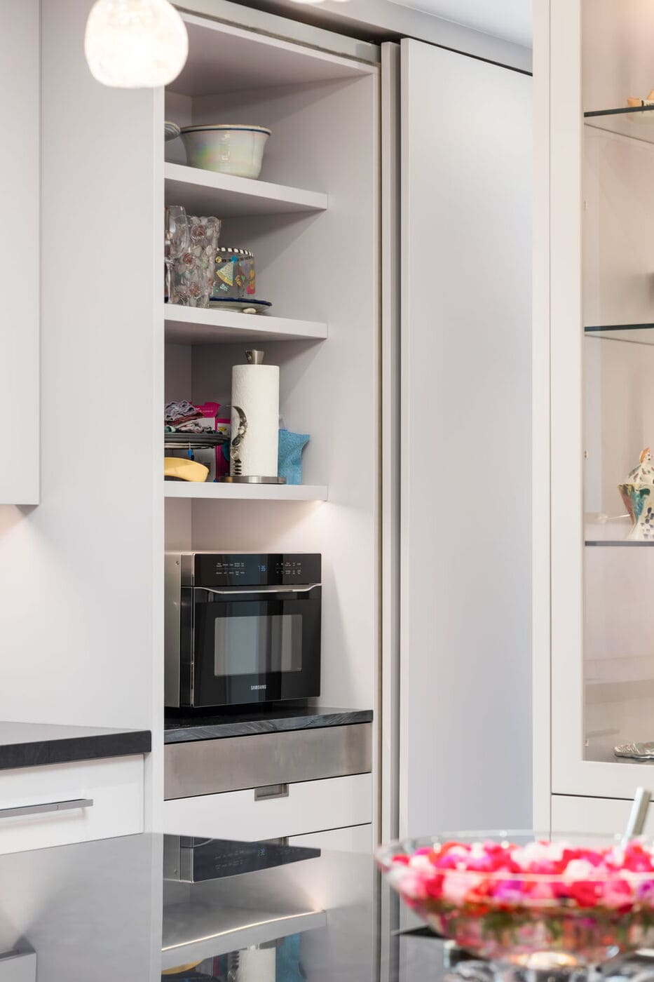 Greenwood Village, CO kitchen with built-in microwave, open shelving, and modern cabinetry by Cillessen Construction