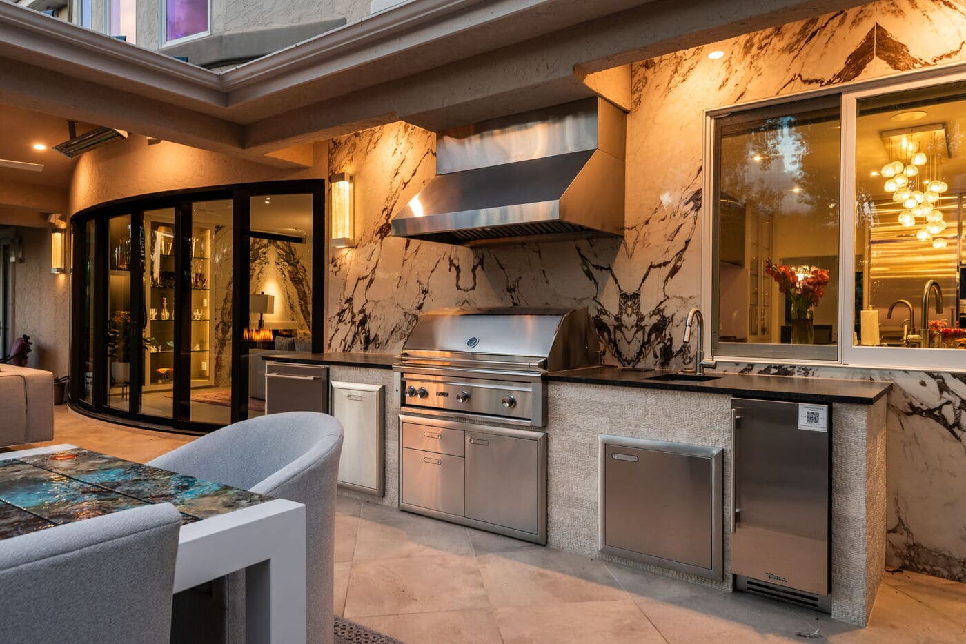 Greenwood Village, CO outdoor kitchen with marble backsplash and grill, renovation by Cillessen Construction Greenwood Village, CO outdoor kitchen with marble backsplash and grill, renovation by Cillessen Construction